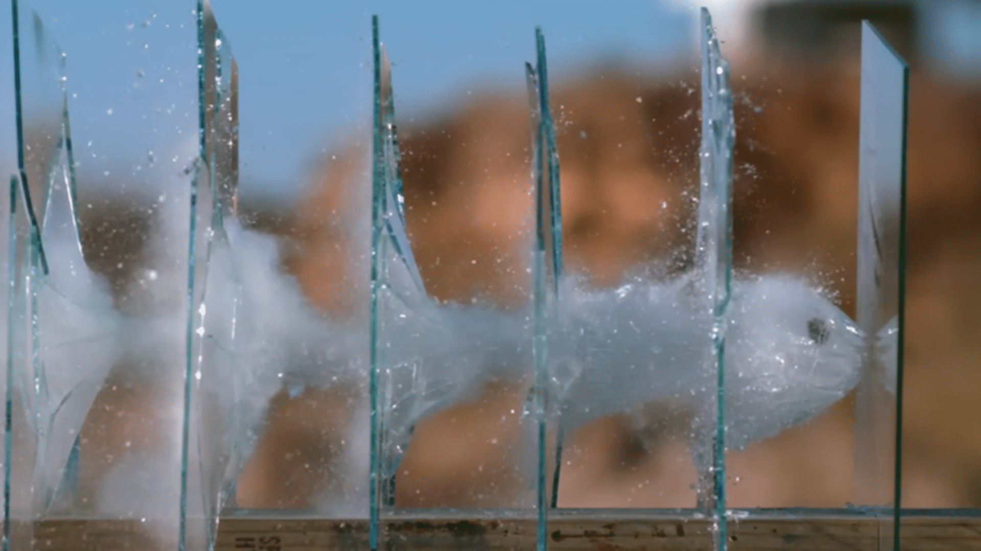Bullet Passing Through Glass with Spall