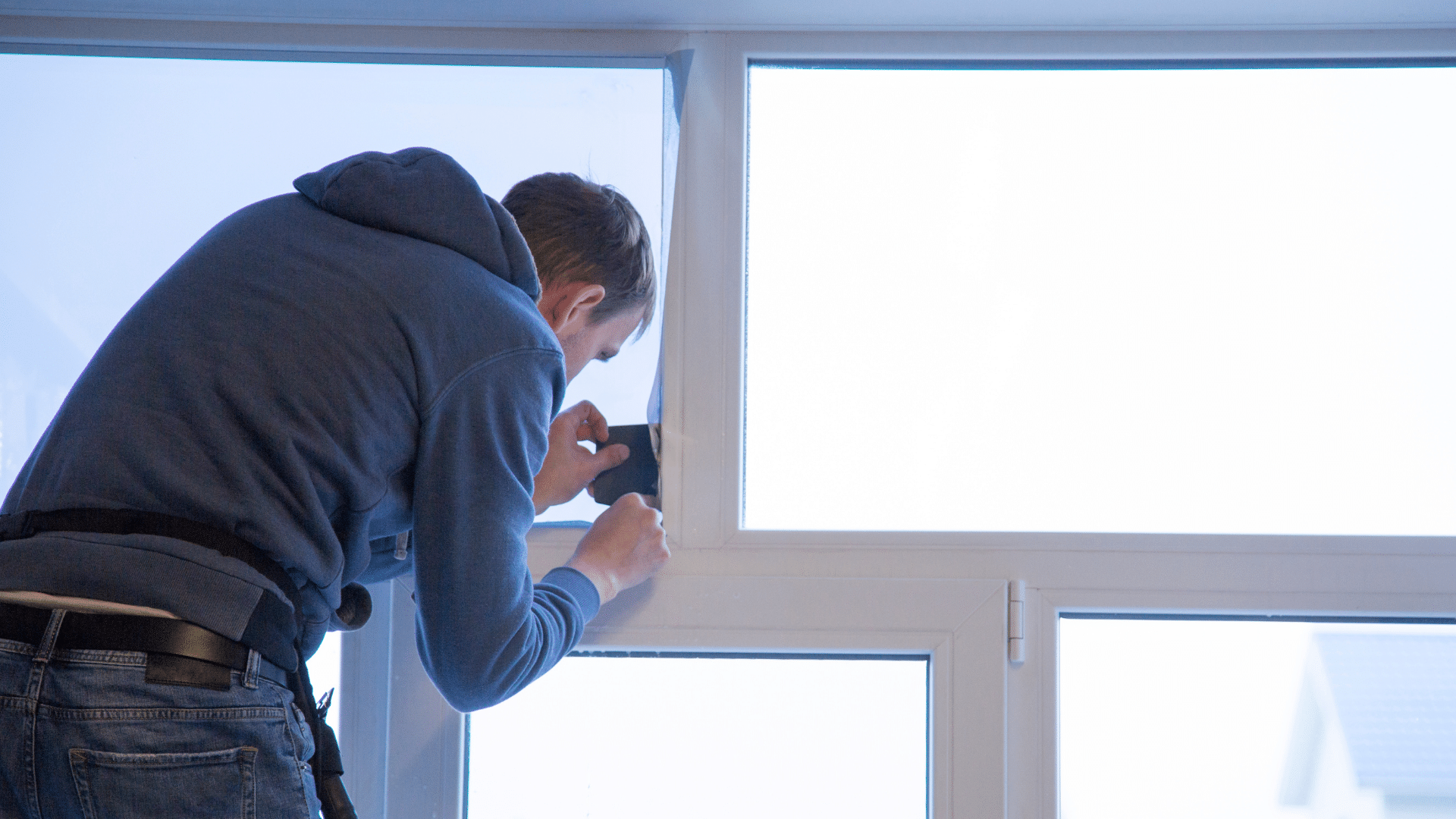 Man Applying Window Film
