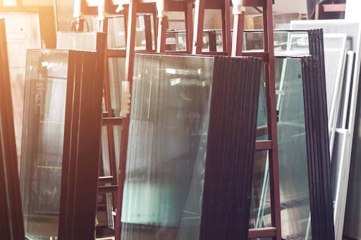 stacked bulletproof and ballistic glass panels in a storage room